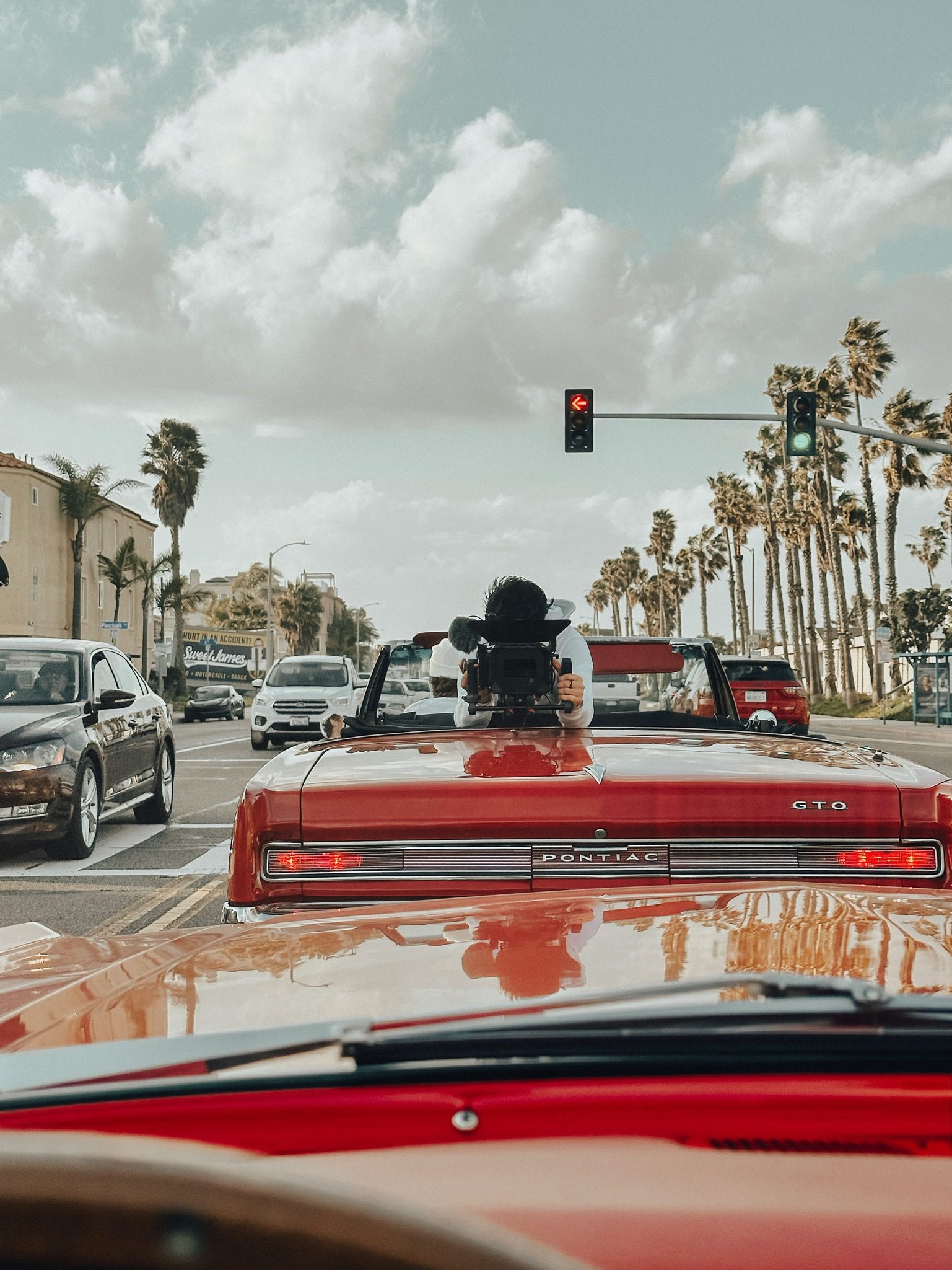 Filming from a classic Pontiac GTO on a Southern California street